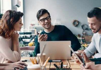 Marketing apprentices A group of young digital professionals are sitting around a conference table discussing ideas